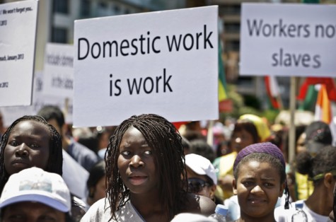 Migrant domestic workers, hold banners demanding basic labor rights as Lebanese workers, during a march at Beiruts seaside, Lebanon, Sunday, April 28, 2013. More than 200,000 workers mostly women from Asia and Africa work as maids in a country of 4 million people, many also come from places as far as Madagascar and Nepal, but the majority are from Sri Lanka, the Philippines, Ethiopia and Eritrea. (AP Photo/Hussein Malla)