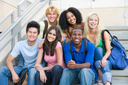 Group of six students outside sitting on steps