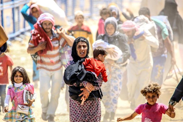 Above - Syrian refugees fleeing the country in 2015